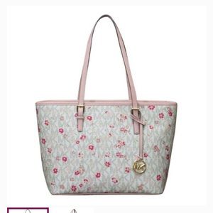 Brand new MK, still has the tags. I bought it and just never have carried it